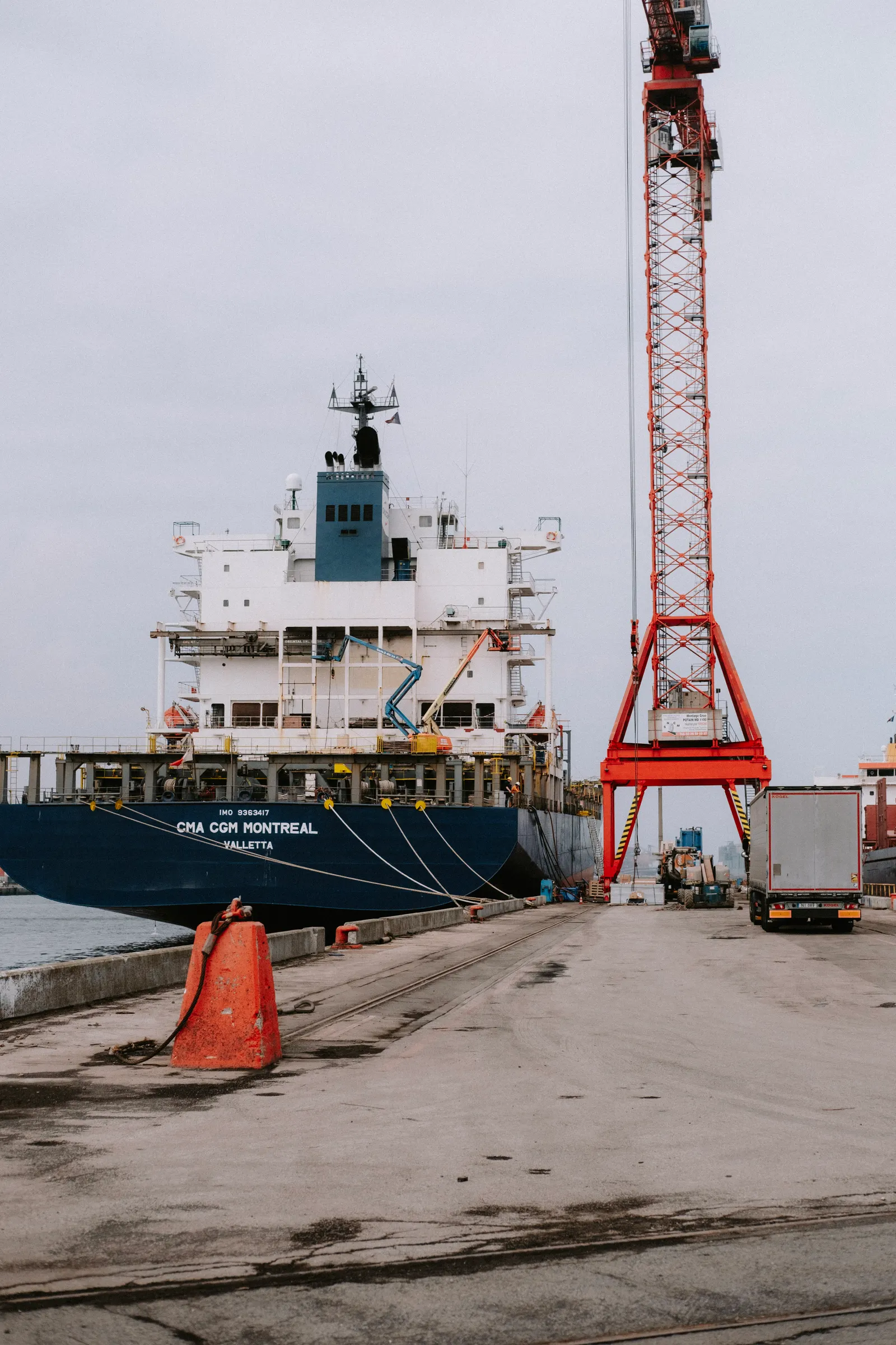 Container ship at a busy cargo port