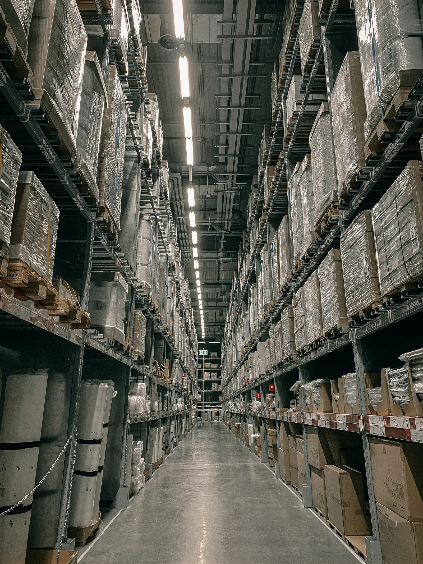Organized warehouse aisle representing shipment visibility and coordination